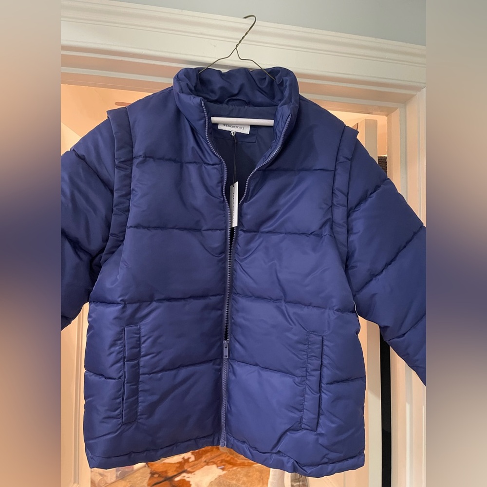 A Weworewhat Navy Blue puffer coat with removable sleeves